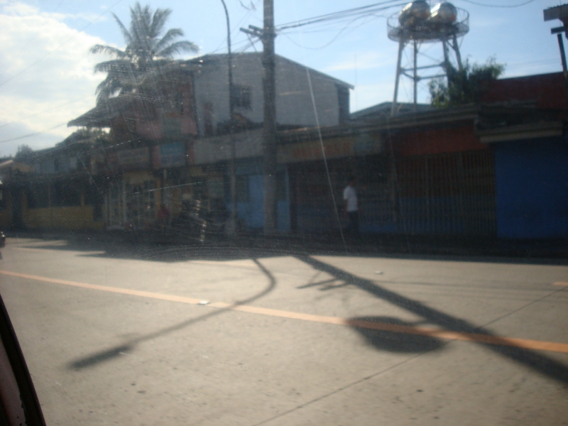 Picture of a street in Manila as viewed from a cab